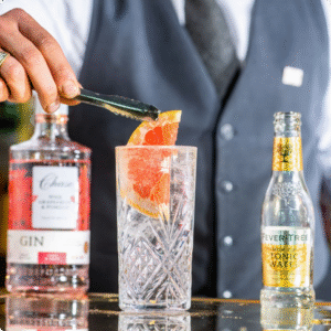 Garnish being added to a G&T