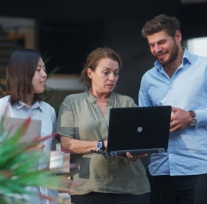 Discover what's new in Totara Version 20 - Image of workers using a laptop